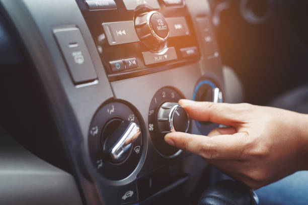 istock Closeup of hand driver man checking switch adjusting air from conditioning the cooling system with flow of cold in car. Leave space for writing text. 1399844688