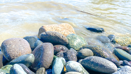The river rocks come in a variety of colors, shapes, and sizes.
