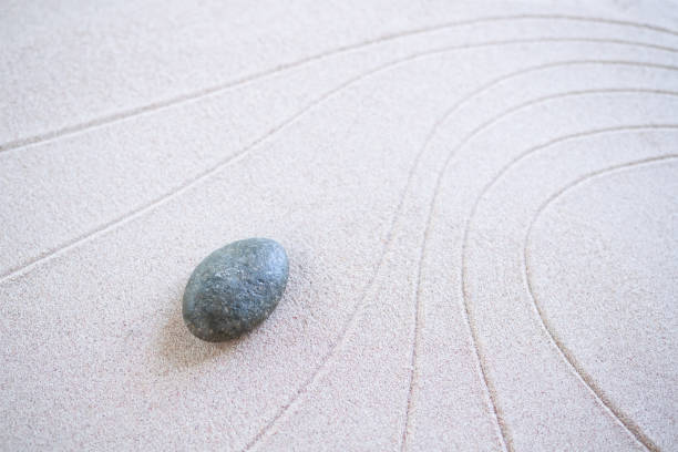 istock Zen Garden Japanese pattern on white sand background. 1399847687