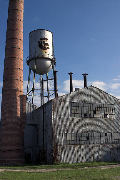 istock Abandoned factory building with water tower and chimney 139984989