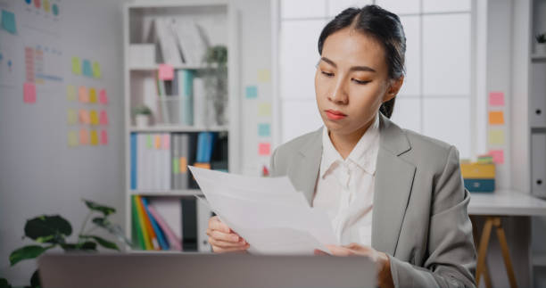 istock Young Asia businesswoman sitting on desk crazy with overworked stress angry massive work scream at office. 1399856432