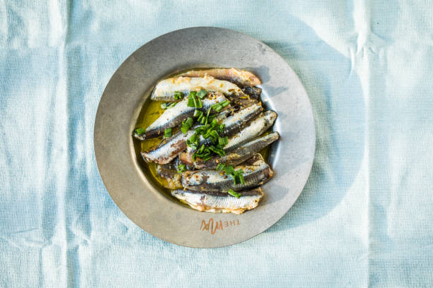 Traditional Spanish pintxos of Cantabrian anchovies in olive oil stock photo