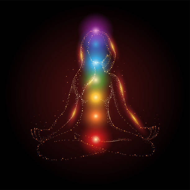 Female figure meditating in lotus position with colorful 7 chakras Particles of female figure meditating in lotus position with colorful 7 chakras and aura glow, vector illustration chakra stock illustrations