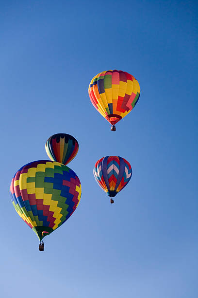 istock Multicolored hot air balloons against clear blue sky 139985895