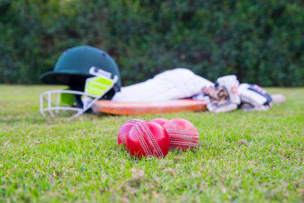istock Cricket equipment laying on grass 1399859883