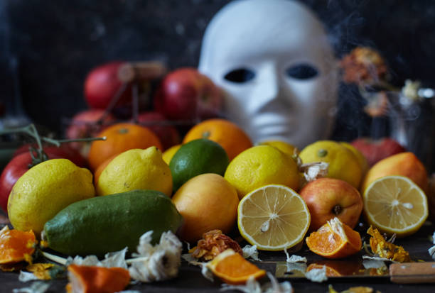 facial mask behind fresh vegetables and fruits