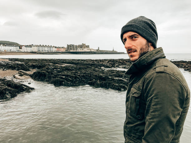 istock solitude man on the pier in winter 1399861184