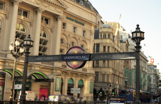 Signs above the entrance to Notting Hill Police Station in London, England.