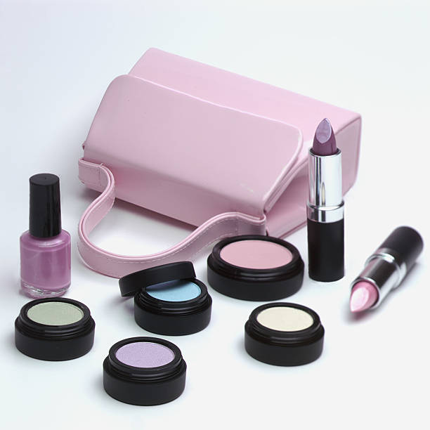 istock Pink purse, lipsticks and assorted pastel eye shadows 139986584
