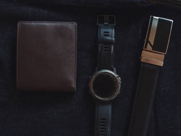 istock Brown leather wallet on jeans background. 1399868635