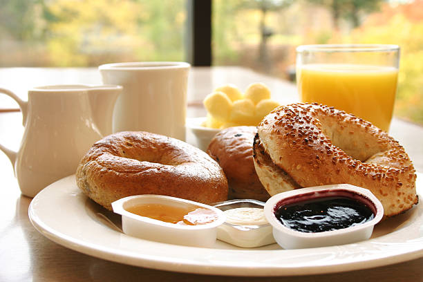 Breakfast buffet food egg, cake, croissant, sausage, coffee, cappuccino