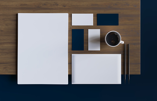 Branding identity template: blank a4, envelope, business card, coffee cup on wood desk