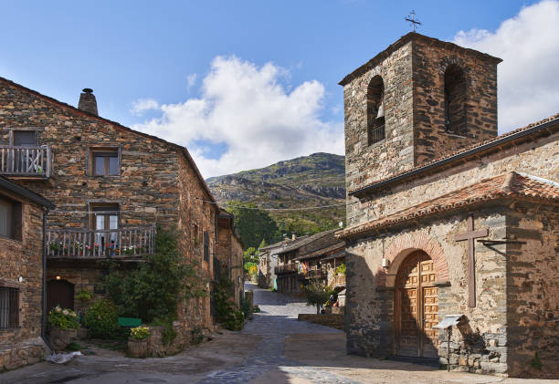 Streets of Valverde de los Arroyos (Spain). Typical stone constructions and black slate roofs. Rural.