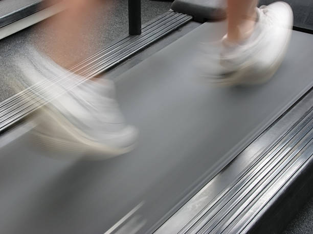 istock A woman running fast on a treadmill 139987265
