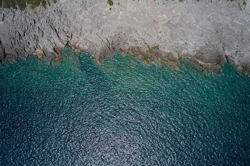 analogue photo of the granite rocks eroded by the wind on the beaches of Gallura in Sardinia