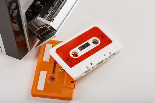 Audio cassette tapes with hi-fi stereo player at the background