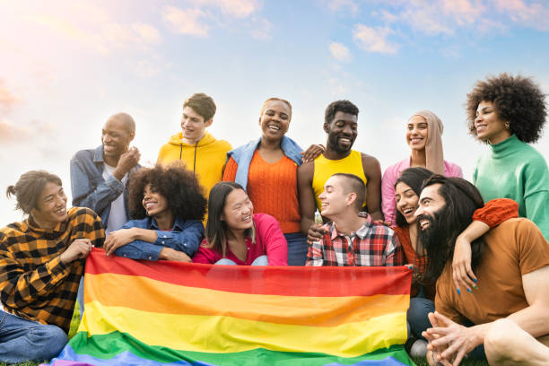 istock group of diverse young people having fun outdoors laughing together with gay flag protesting lgbt 1399875866