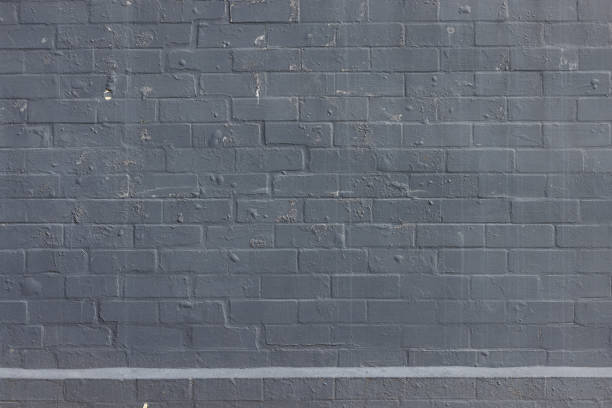 Old stained gray brick wall.