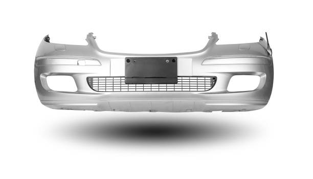 Silver car bumper with a black plastic panel on an isolated background, part for installation on a car body after repair and painting during repair in a workshop. Equipment for sale