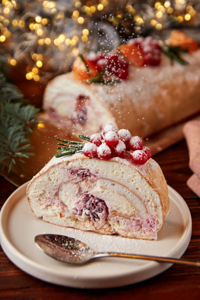 istock Slice of meringue roll with cherries decorated for Christmas. 1399876980