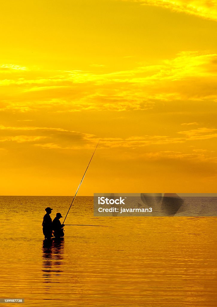 Pesca al tramonto - Foto stock royalty-free di Pesca a mosca