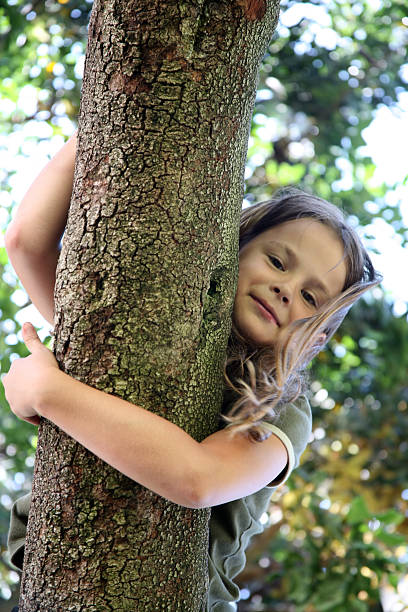 istock A young girl hanging out on a limb 139987810