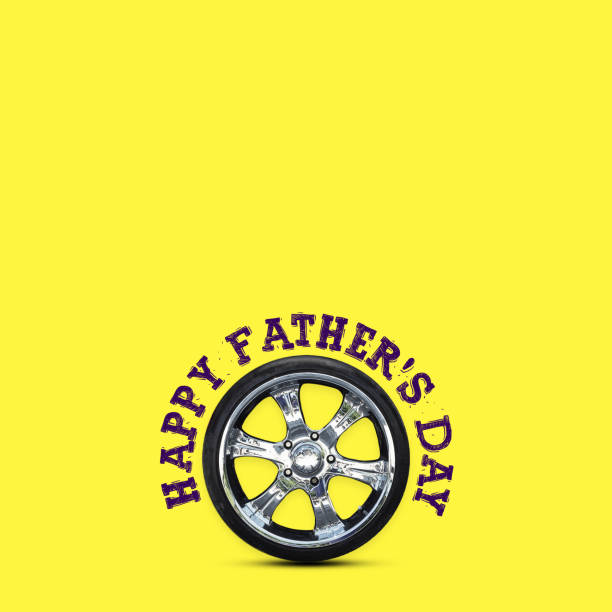 Happy Father's Day background. Auto wheel, on a yellow background. Copy space. Place for text. Festive background. Holidays. Congratulation.
