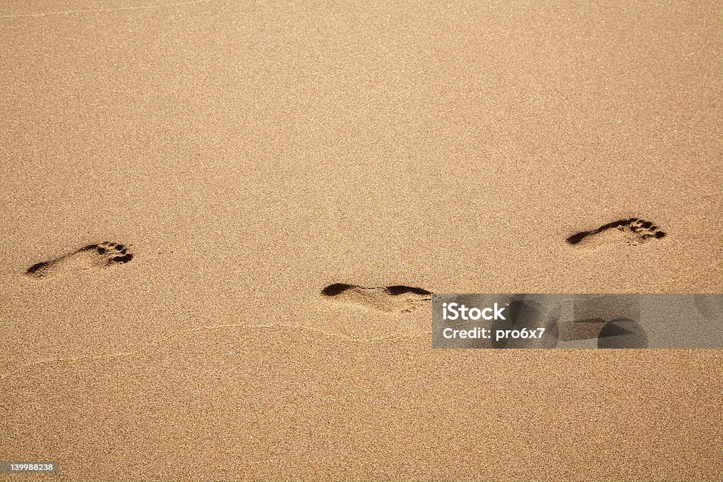 Footprints Footprints in the sand Beach Stock Photo