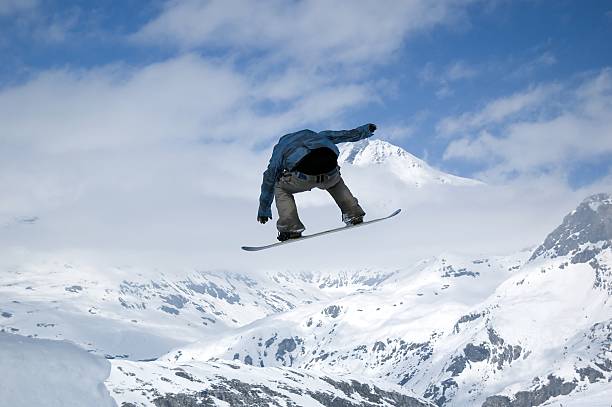 istock snowboarder jumping high in the air 139988553