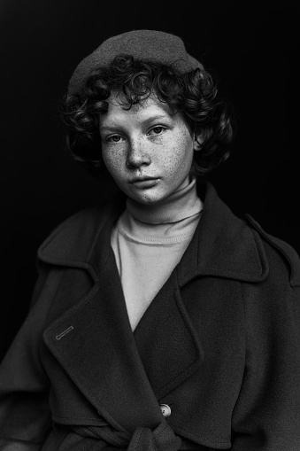 Black and white portrait of a beautiful woman with freckles