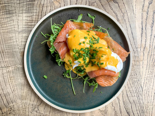 istock Eggs benedict with smoked salmon rocket on toast. Breakfast in cafe 1399892001