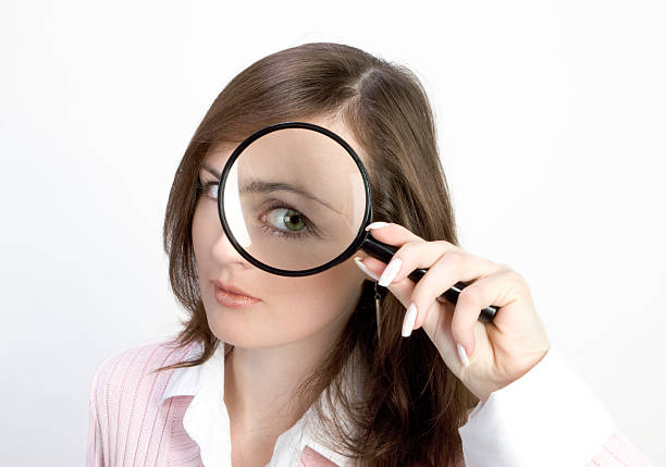 若い女性、拡大鏡 - low scale magnification glass women holding ストックフォトと画像