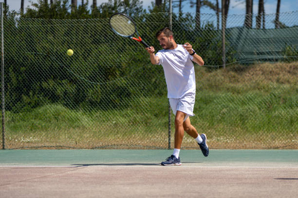 istock Tennis player hitting forehand at ball 1399893655