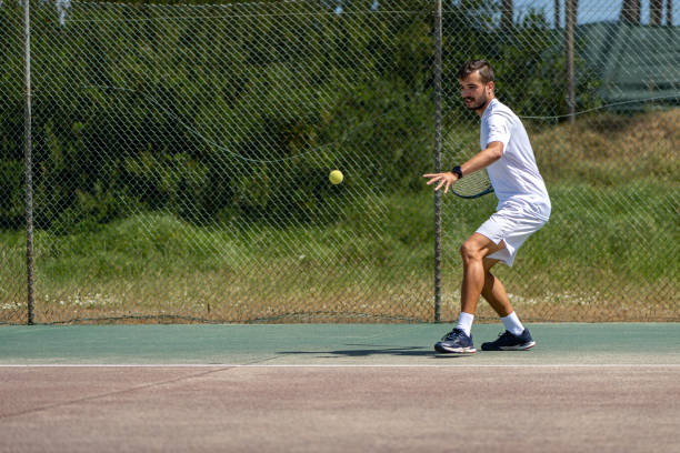 istock Tennis player hitting forehand at ball 1399893672