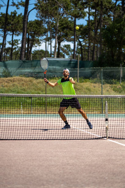 istock Tennis player performing a smash 1399893831