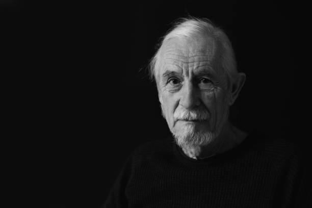 istock Low key black and white portrait of old man 1399893877