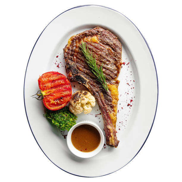 istock Isolated portion of grilled steak with vegetables 1399898404