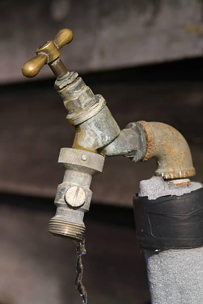 istock Old brass yard tap, with water running 139989842