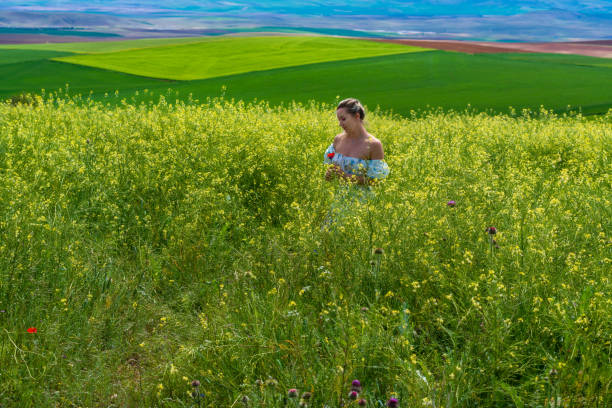 istock Happy Young Woman at Fields in Springtime 1399899693