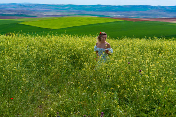 istock Happy Young Woman at Fields in Springtime 1399899985