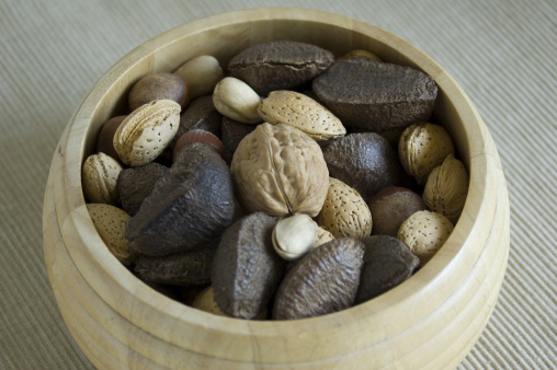 Mixed nuts in a wooden bowl.