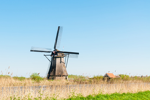 A18th Century traditional Dutch windmill, at Kinderdijk in South Holland.