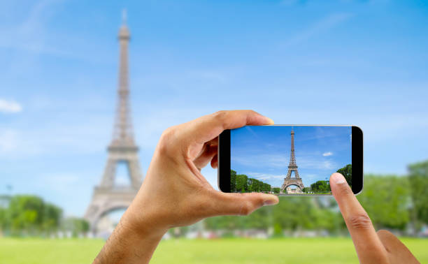 istock taking a photo of eiffel tower at paris 1399905897