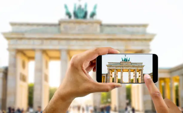 Photo of taking a photo of a brandenburg gate in berlin