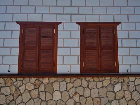 closed wooden windows of an old house