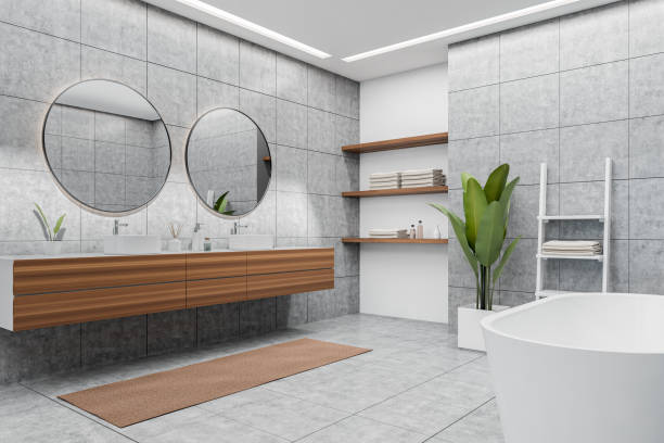 istock Corner view on bright bathroom interior with bathtub, round mirrors 1399906938