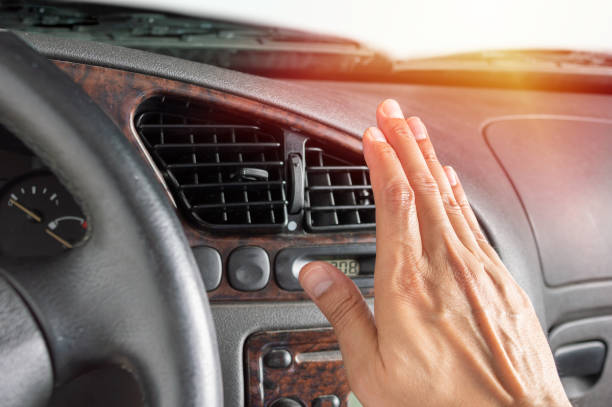 driver man adjusting air conditioner in the car - car air conditioner vehicle interior driving imagens e fotografias de stock