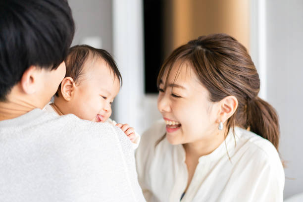 istock A baby happy to be held by his father 1399907043