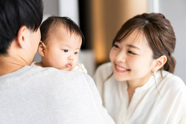 istock A baby happy to be held by his father 1399907056