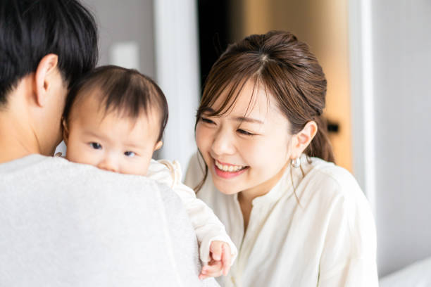 istock A baby happy to be held by his father 1399907078